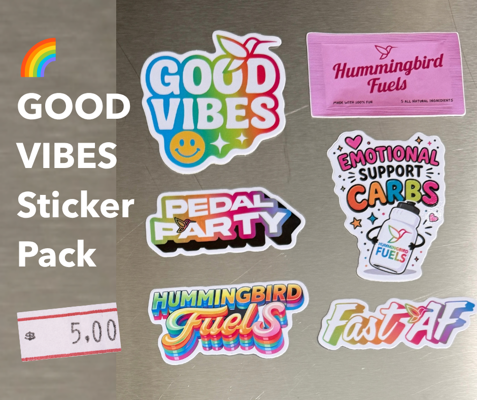 A sticker pack set displayed on a brushed metal surface, featuring multiple colorful die-cut stickers with text like 'GOOD VIBES Sticker Pack,' 'Hummingbird Fuels,' 'Emotional Support Carbs,' and 'Fast AF.' A small price tag showing 5.