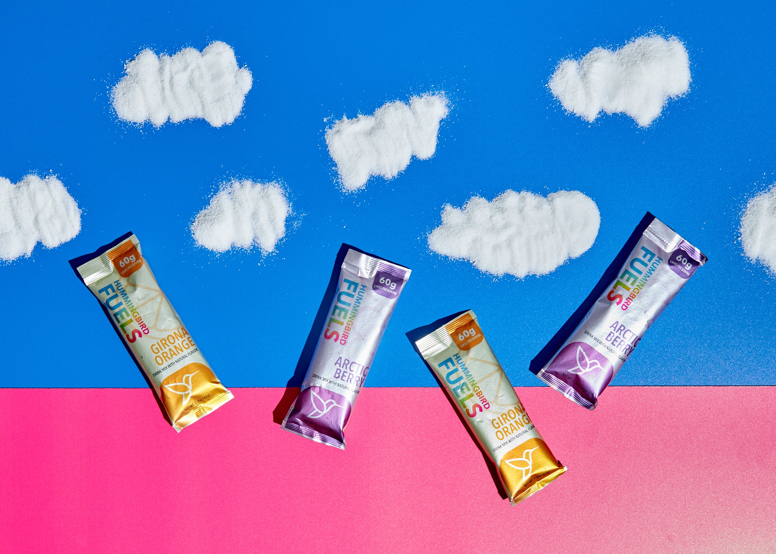 Hummingbird Fuels Single Serve Sachets against a multicolored backdrop